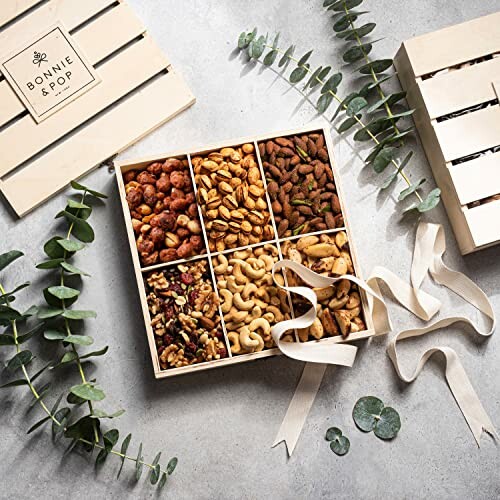 Gourmet nut gift box with six sections of assorted nuts.